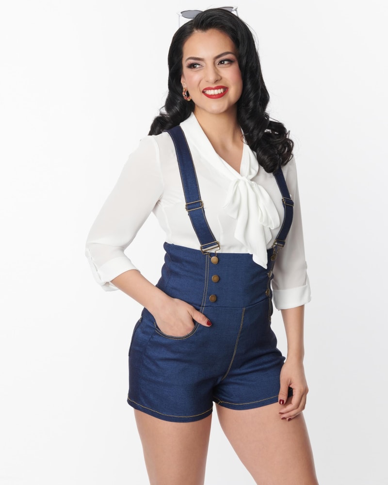 Front of a model wearing a size 2X Unique Vintage Blue Denim Pinafore Shorts in Blue by Unique Vintage. | dia_product_style_image_id:300944